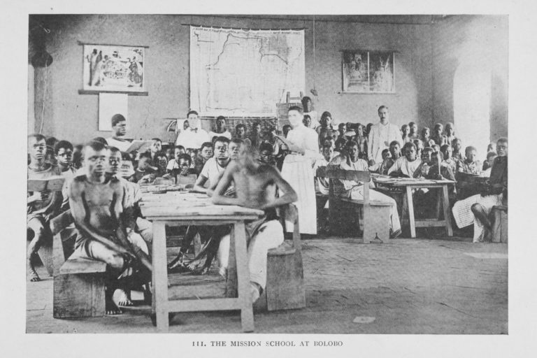 Photograph of students in classroom with teachers