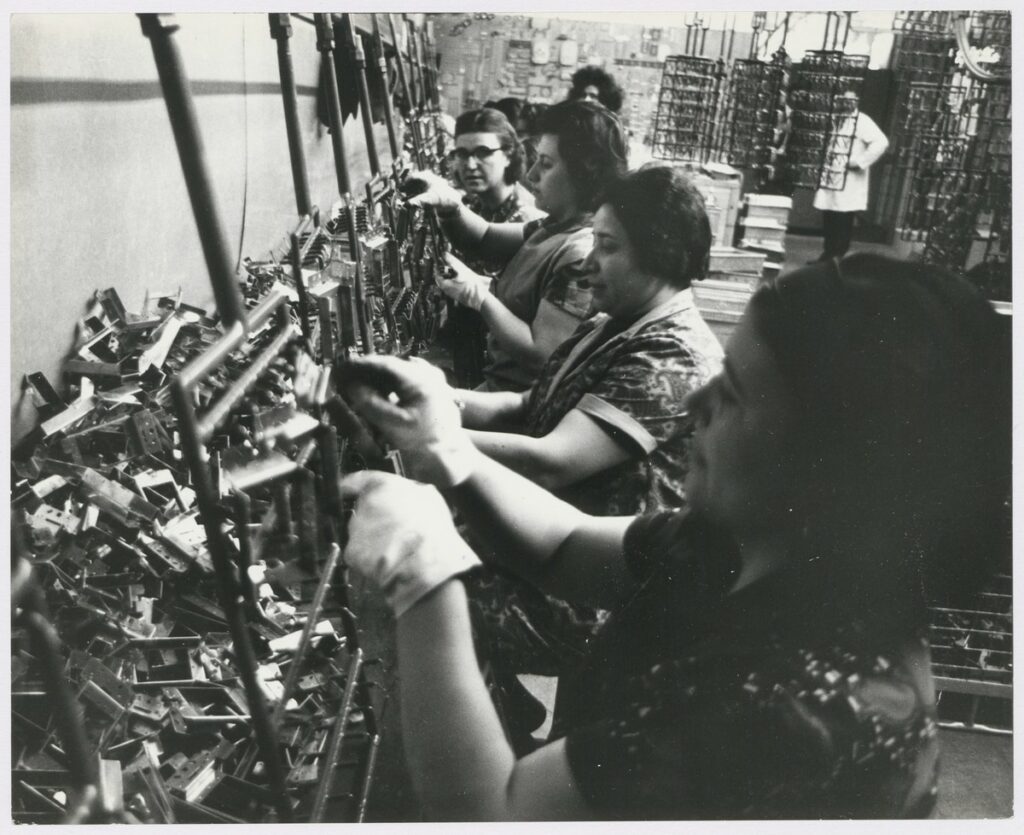 Migrant women working in telephone manufacturing