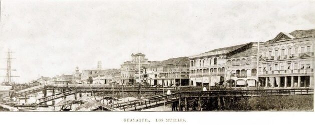 Historical sepia-toned image of Guayaquil's ports with dilapidated piers extending into the water.