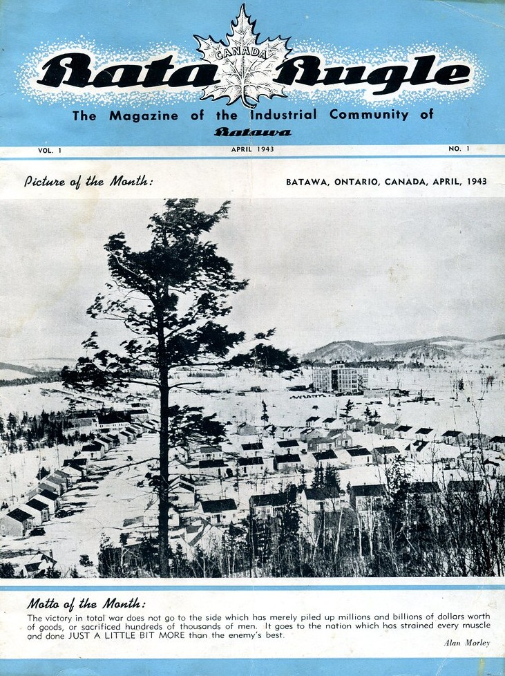 Factory building and rows of identical houses with a tree in the foreground, all in black and white, on a magazine cover